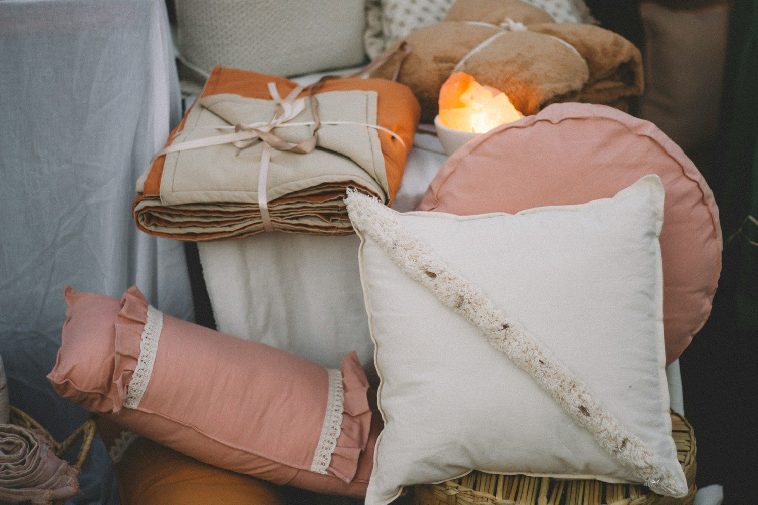 Decorative-cozy-throw-pillows-with-soft-fabric-covers-on-a-living-room-sofa