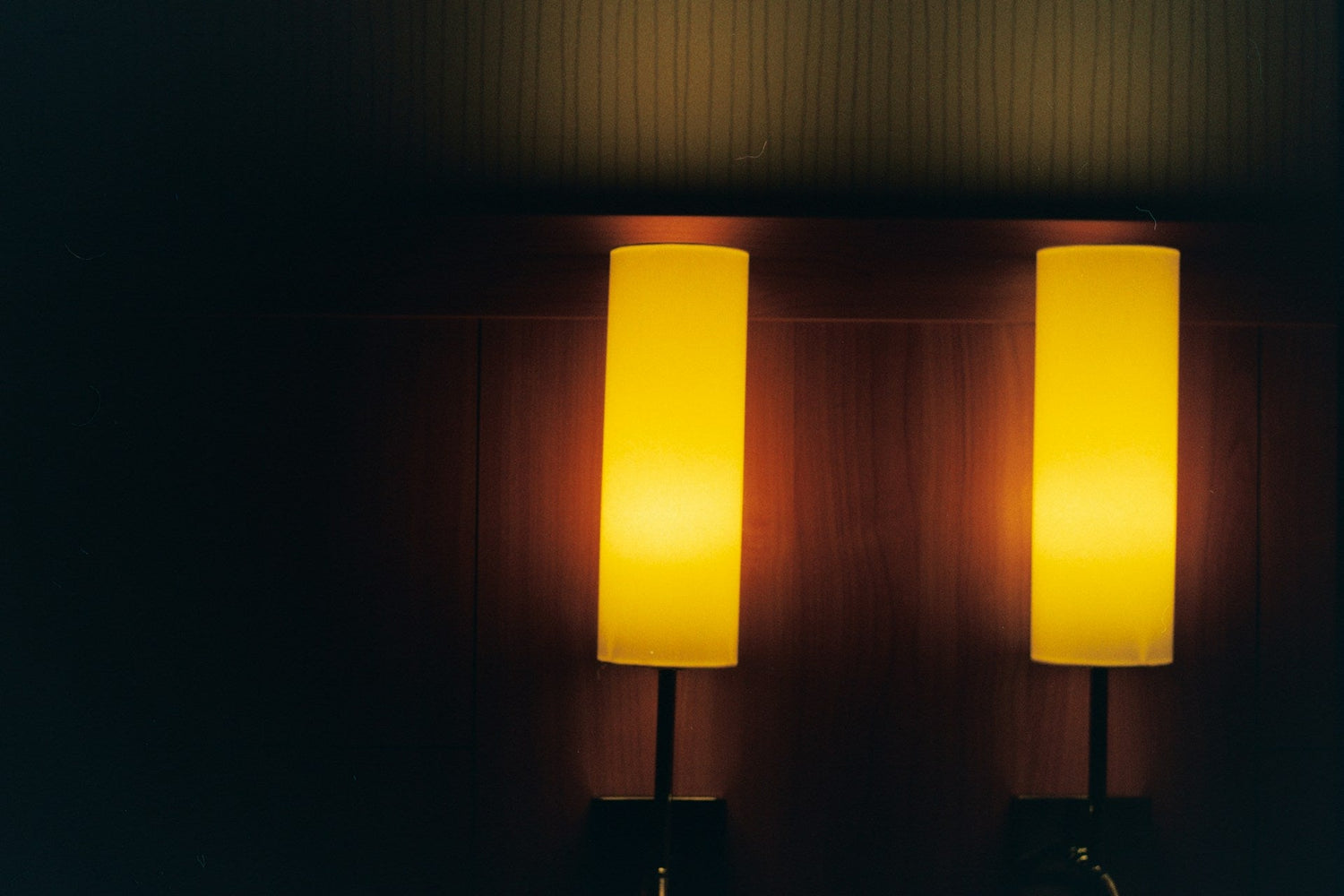 Tall-standing-floor-lamp-with-beige-fabric-shade-in-living-room